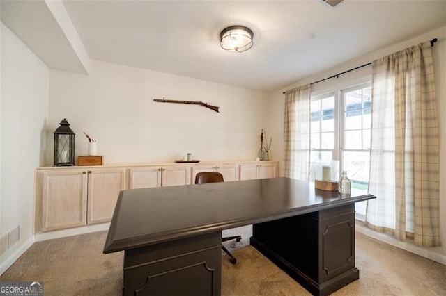 home office with light colored carpet
