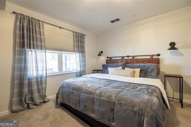 carpeted bedroom with baseboards