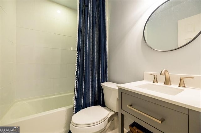 bathroom with toilet, shower / tub combo, and vanity