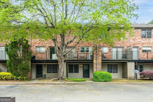 view of front of house featuring brick siding