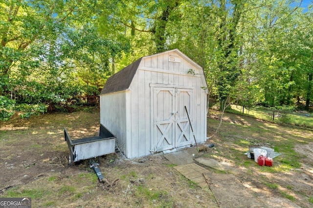 view of shed with fence