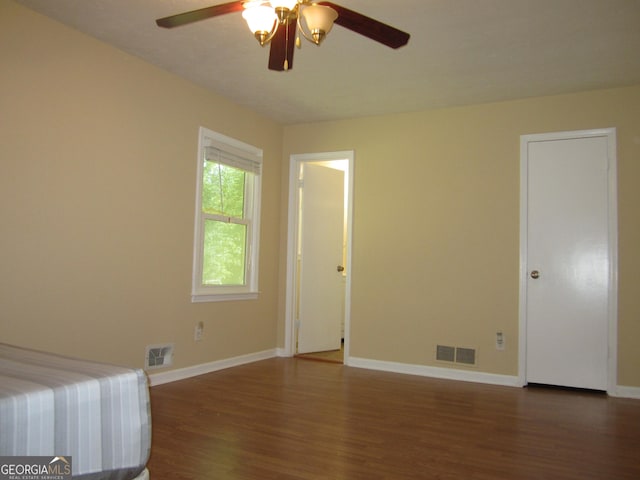 2107 Briarwood Ct, Snellville, GA 30078 - unfurnished bedroom featuring visible vents, baseboards, and wood finished floors