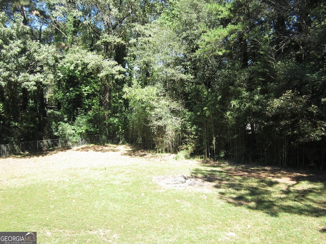 2107 Briarwood Ct, Snellville, GA 30078 - view of yard featuring a forest view and fence