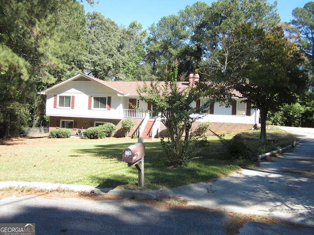 2107 Briarwood Ct, Snellville, GA 30078 - view of front facade with a front lawn and stairs