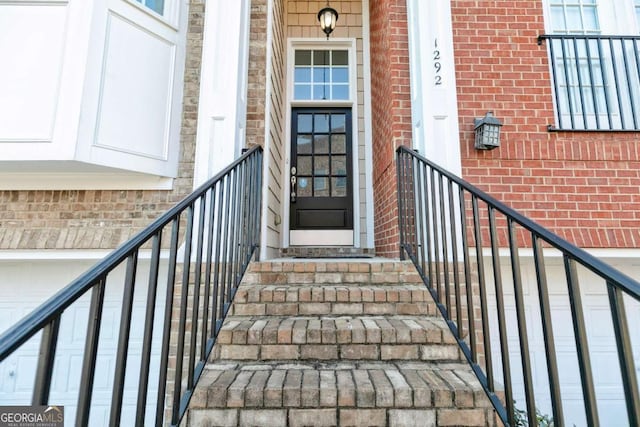 property entrance with brick siding