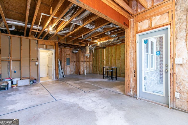 below grade area with a garage and electric panel