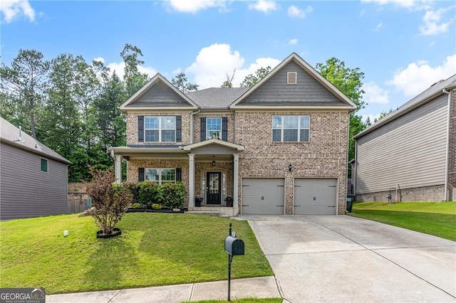 craftsman inspired home featuring brick siding, a garage, a front lawn, and driveway