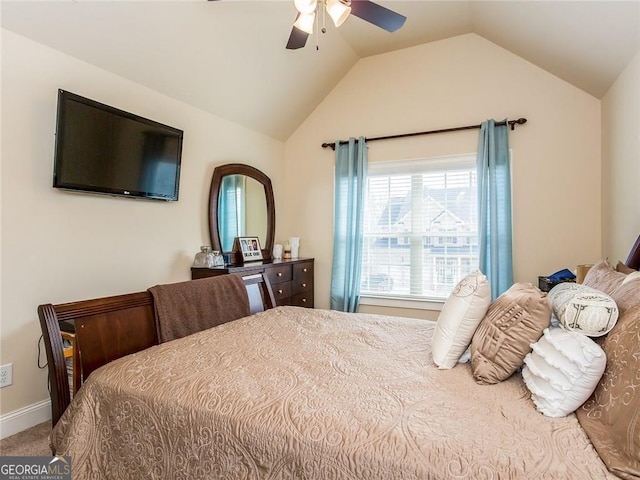 carpeted bedroom with baseboards, ceiling fan, and lofted ceiling
