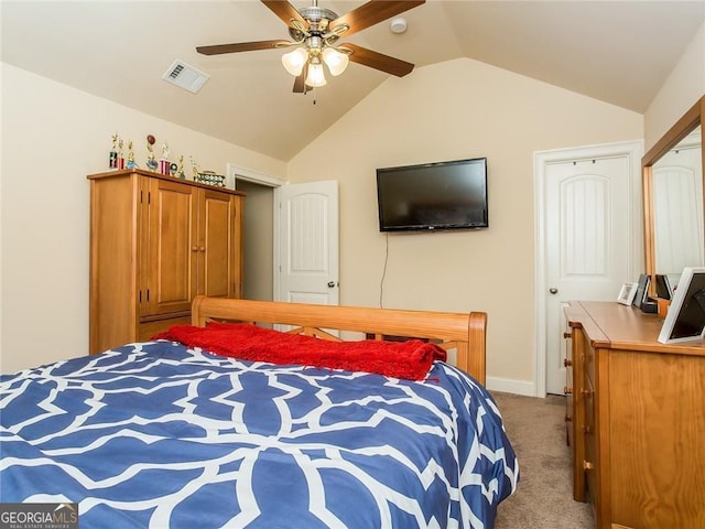 carpeted bedroom with visible vents, a ceiling fan, baseboards, and vaulted ceiling