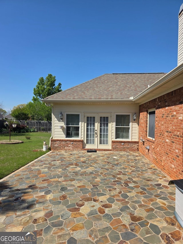 view of patio / terrace featuring french doors and fence