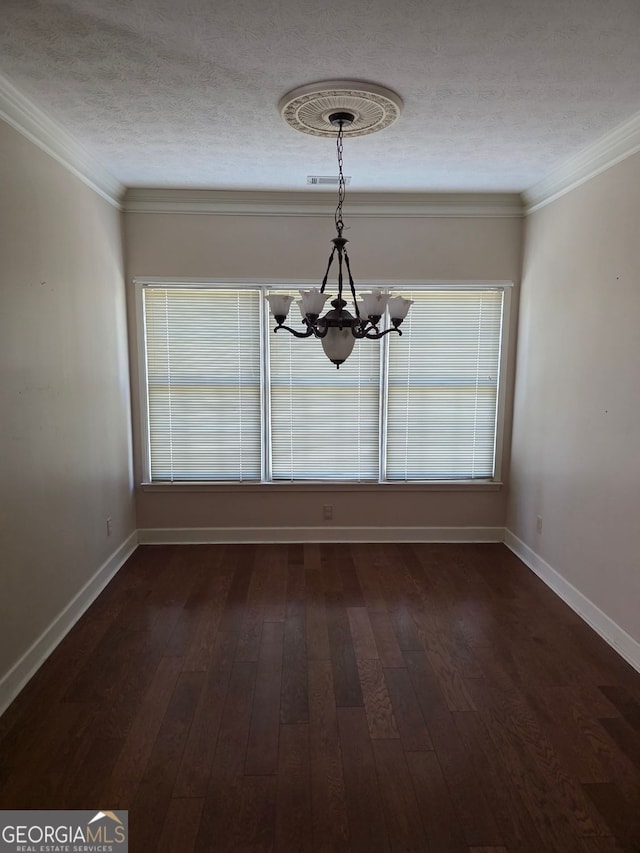 unfurnished dining area featuring dark wood finished floors, an inviting chandelier, baseboards, and a textured ceiling