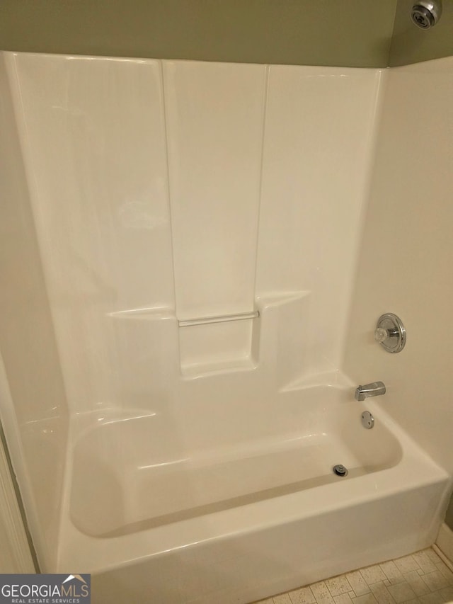 bathroom featuring washtub / shower combination