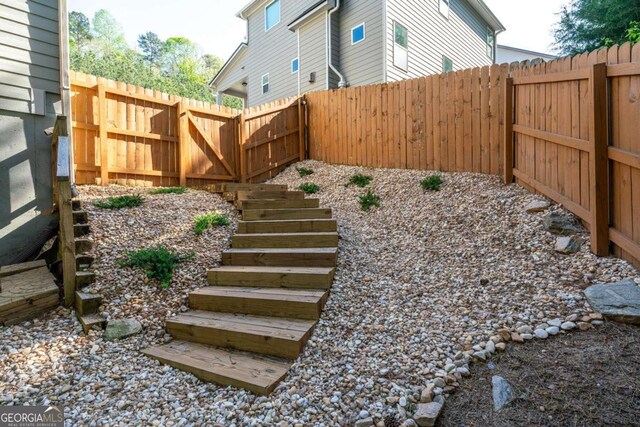6424 Barker Station Walk, Sugar Hill, GA 30518 - fenced backyard with stairway