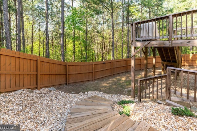 6424 Barker Station Walk, Sugar Hill, GA 30518 - fenced backyard featuring a wooden deck