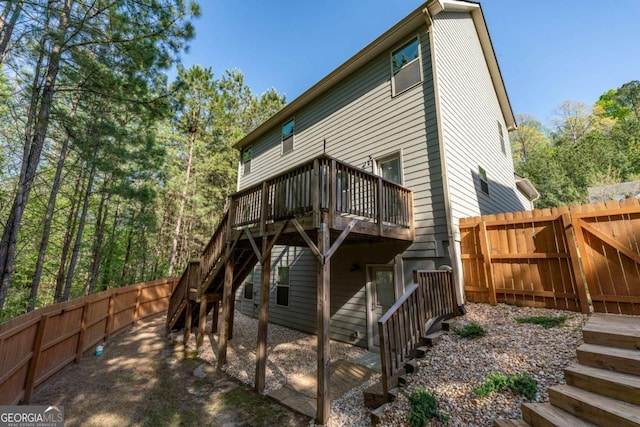 6424 Barker Station Walk, Sugar Hill, GA 30518 - back of house featuring stairs, a deck, and a fenced backyard