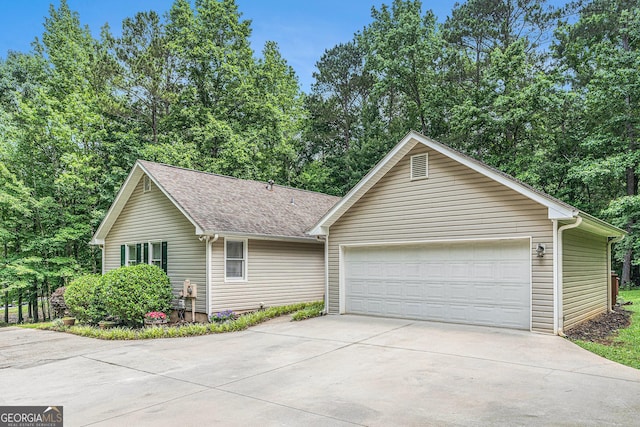 469 Kimberly Ct, Mcdonough, GA 30252 - ranch-style home with roof with shingles, concrete driveway, and an attached garage