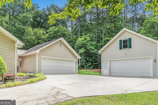 469 Kimberly Ct, Mcdonough, GA 30252 - detached garage featuring view of scattered trees