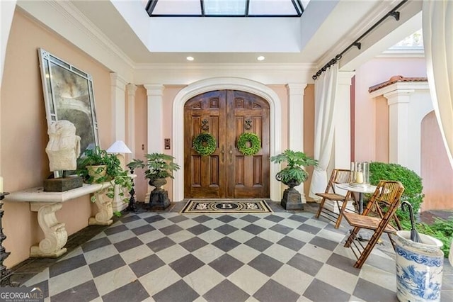 view of exterior entry featuring covered porch