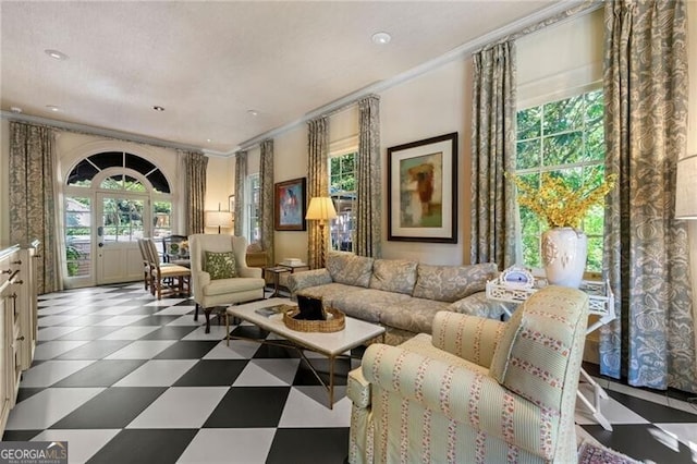 sitting room featuring crown molding, tile patterned floors, and recessed lighting
