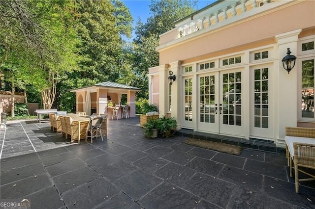 view of patio featuring french doors and outdoor dining space