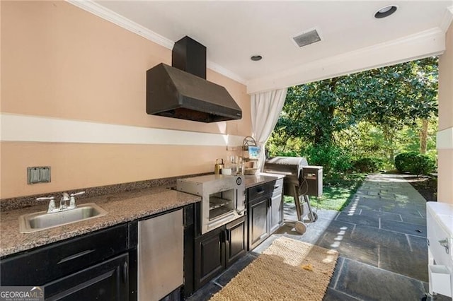 view of patio with a sink, visible vents, area for grilling, and an outdoor kitchen
