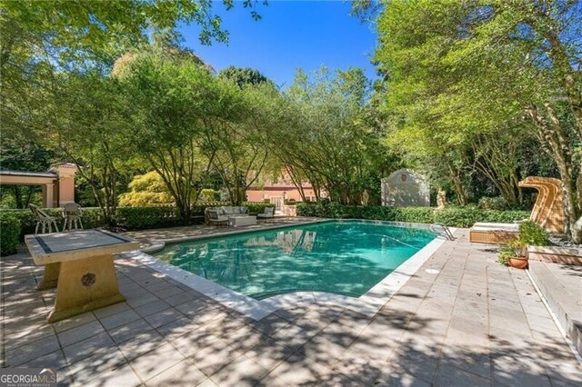 outdoor pool with a patio