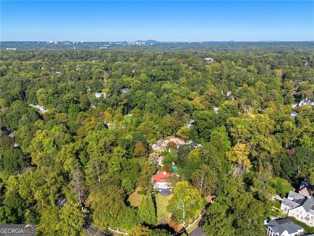 birds eye view of property with a forest view