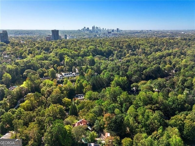 bird's eye view featuring a wooded view