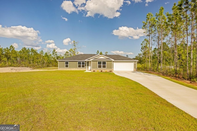 ranch-style house featuring an attached garage, concrete driveway, and a front yard