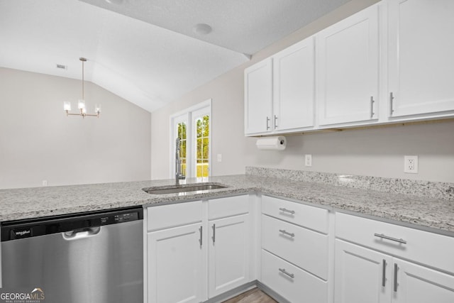 kitchen featuring a sink, a chandelier, white cabinetry, vaulted ceiling, and stainless steel dishwasher