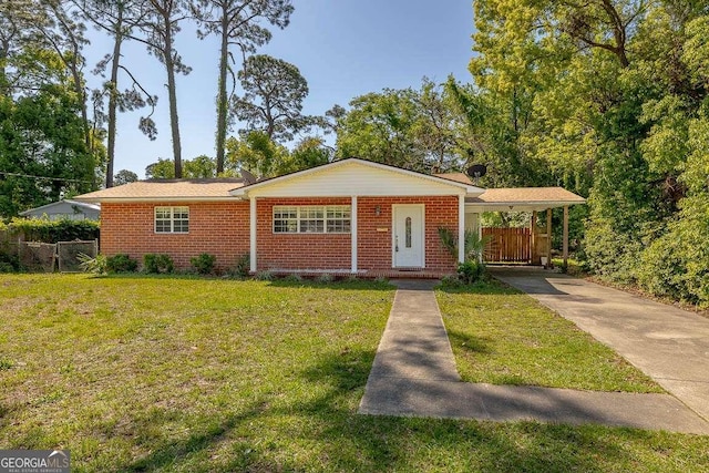 view of front of property featuring a front yard, a gate, fence, concrete driveway, and an attached carport
