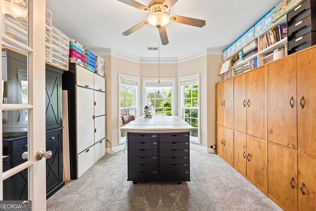 spacious closet featuring visible vents, a ceiling fan, and light carpet
