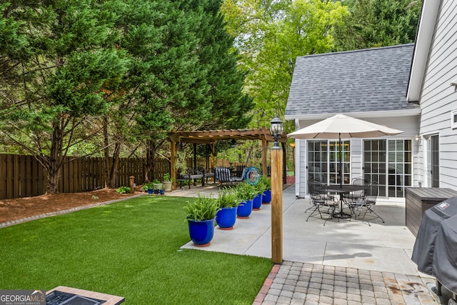 view of yard featuring a patio, a pergola, and fence private yard