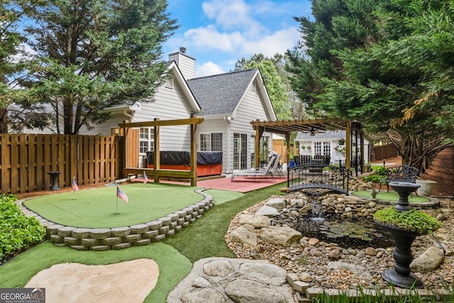 view of yard featuring a patio, a fenced backyard, and a pergola