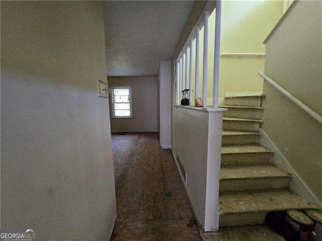1846 Markone St NW, Atlanta, GA 30318 - stairway featuring baseboards and a textured ceiling