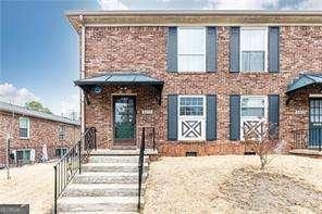 5672 Kingsport Dr Unit 4, Atlanta, GA 30342 - view of front of house featuring brick siding