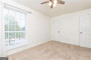 5672 Kingsport Dr Unit 4, Atlanta, GA 30342 - unfurnished room featuring plenty of natural light and ceiling fan