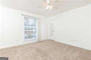 5672 Kingsport Dr Unit 4, Atlanta, GA 30342 - empty room featuring ceiling fan