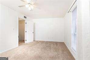 5672 Kingsport Dr Unit 4, Atlanta, GA 30342 - unfurnished room with carpet flooring and baseboards