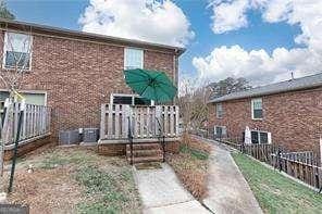 5672 Kingsport Dr Unit 4, Atlanta, GA 30342 - back of house with brick siding