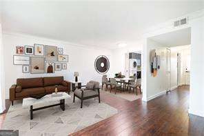 5672 Kingsport Dr Unit 4, Atlanta, GA 30342 - living area featuring crown molding and wood finished floors