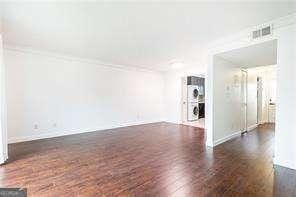 5672 Kingsport Dr Unit 4, Atlanta, GA 30342 - spare room with visible vents, baseboards, and wood finished floors