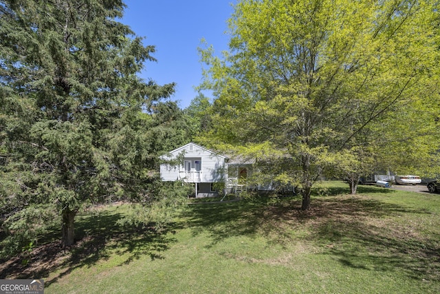 view of yard featuring a view of trees