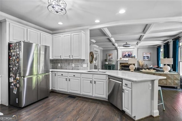 1326 Benbrooke Ln NW, Acworth, GA 30101 - kitchen with a sink, open floor plan, light countertops, appliances with stainless steel finishes, and a peninsula