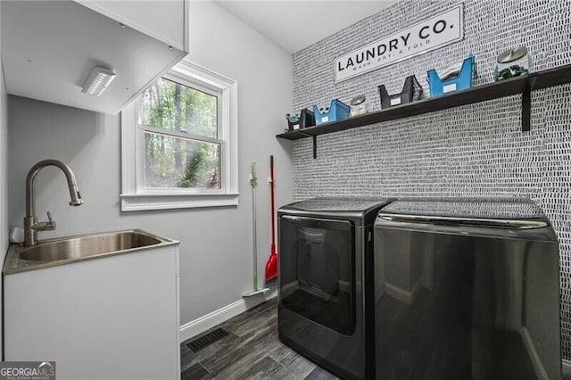 1326 Benbrooke Ln NW, Acworth, GA 30101 - laundry room with baseboards, dark wood-style floors, laundry area, washer and dryer, and a sink