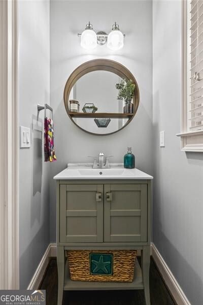 1326 Benbrooke Ln NW, Acworth, GA 30101 - bathroom with wood finished floors, vanity, and baseboards