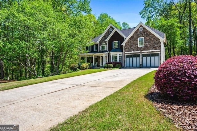 1326 Benbrooke Ln NW, Acworth, GA 30101 - view of front of property with concrete driveway, a front lawn, stone siding, and an attached garage