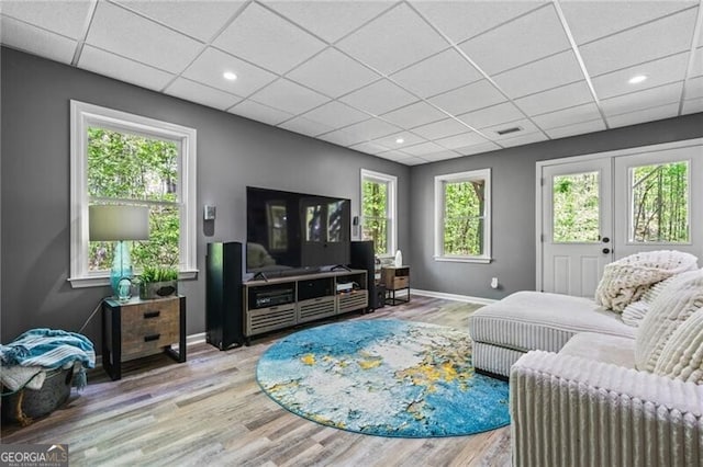 1326 Benbrooke Ln NW, Acworth, GA 30101 - living room with visible vents, baseboards, plenty of natural light, a paneled ceiling, and wood finished floors