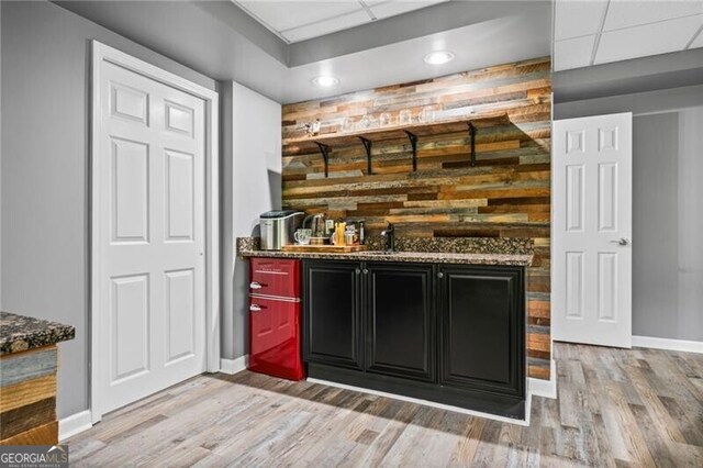 1326 Benbrooke Ln NW, Acworth, GA 30101 - bar with light wood-style flooring, baseboards, wet bar, and a drop ceiling
