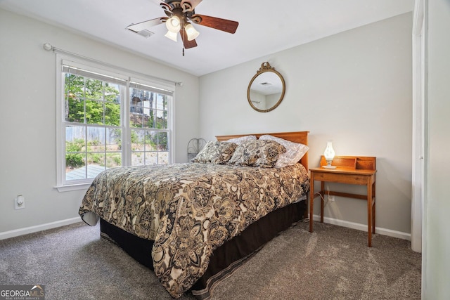 carpeted bedroom with baseboards, ceiling fan, and multiple windows